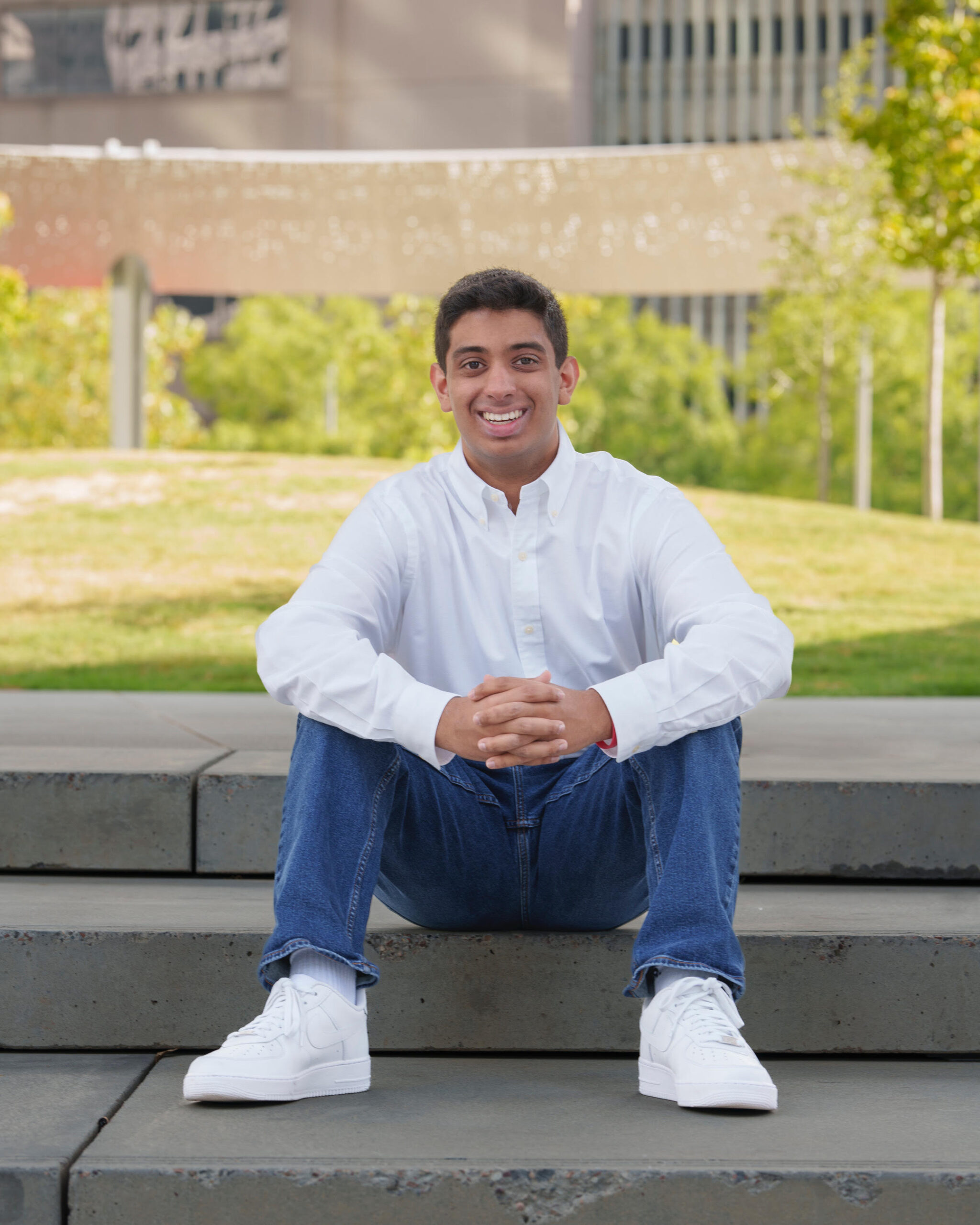 Kaden Alibhai sitting on stairs